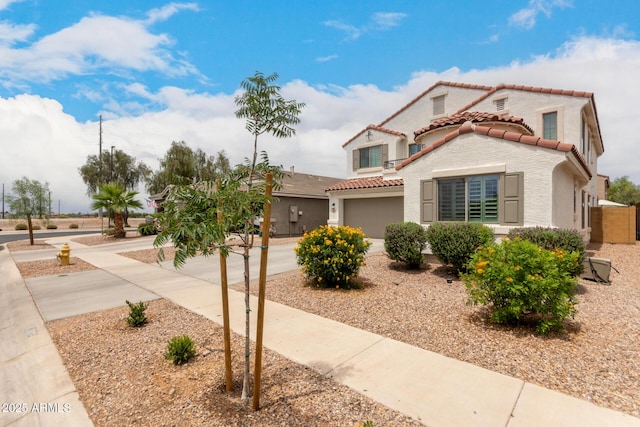4142 E Sandy Way, Gilbert, AZ 85297 - mediterranean / spanish house with driveway, a tiled roof, stucco siding, and a garage