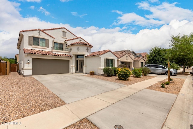4142 E Sandy Way, Gilbert, AZ 85297 - mediterranean / spanish house featuring driveway, stucco siding, a tiled roof, and an attached garage
