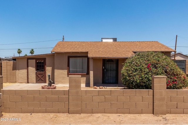 2562 E Wier Ave, Phoenix, AZ 85040 - view of front of house featuring roof with shingles and stucco siding