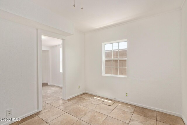 2562 E Wier Ave, Phoenix, AZ 85040 - empty room featuring light tile patterned floors and baseboards