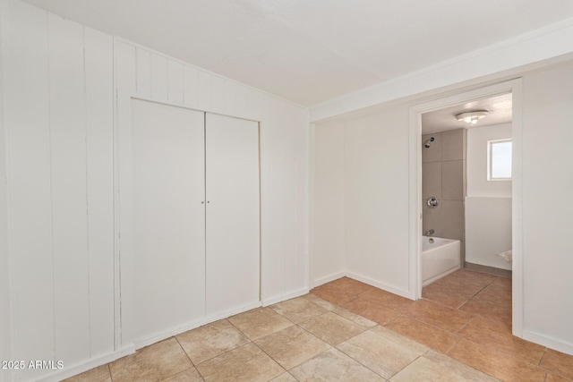 2562 E Wier Ave, Phoenix, AZ 85040 - unfurnished bedroom featuring a closet and ensuite bathroom