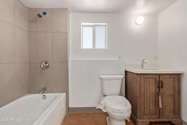 2562 E Wier Ave, Phoenix, AZ 85040 - bathroom featuring tile patterned floors, toilet, shower / bathtub combination, and vanity