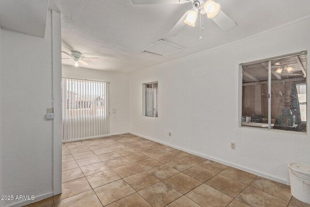 2562 E Wier Ave, Phoenix, AZ 85040 - tiled spare room with a ceiling fan, baseboards, and attic access