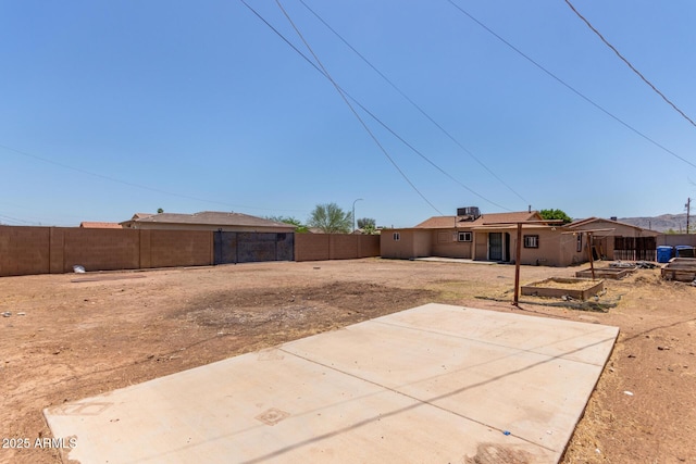 2562 E Wier Ave, Phoenix, AZ 85040 - fenced backyard with a patio area and a garden