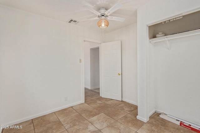 2562 E Wier Ave, Phoenix, AZ 85040 - unfurnished bedroom with a closet, baseboards, and a ceiling fan