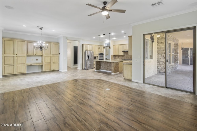 unfurnished living room featuring ornamental molding, ceiling fan with notable chandelier, and light hardwood / wood-style flooring