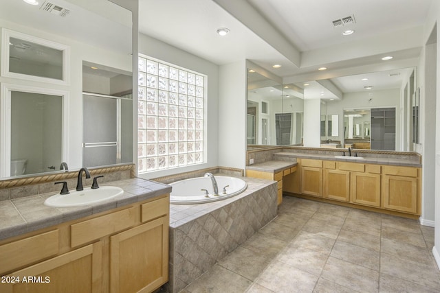 full bathroom with shower with separate bathtub, vanity, tile patterned floors, and toilet