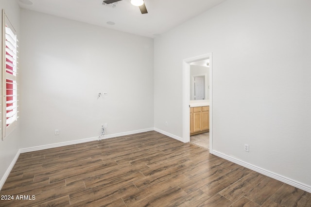 spare room featuring dark hardwood / wood-style floors and ceiling fan