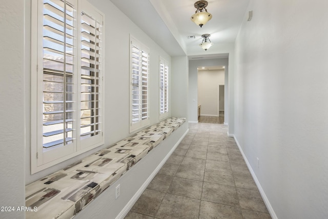 corridor with light tile patterned floors