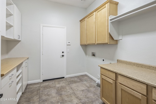 laundry area featuring cabinets, hookup for a washing machine, and electric dryer hookup