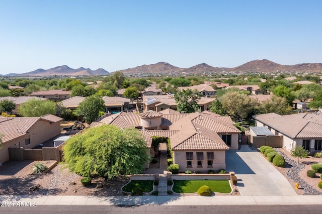 birds eye view of property featuring a mountain view