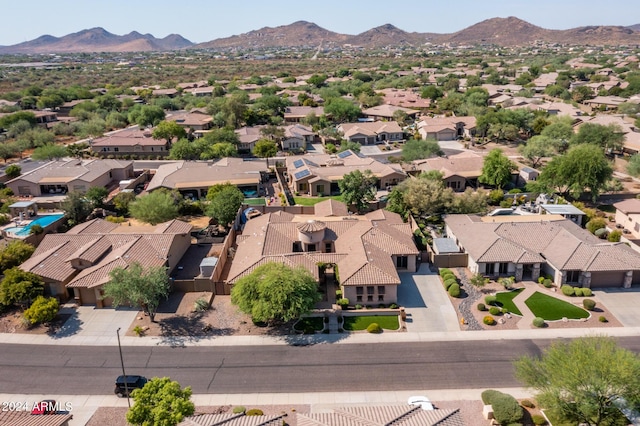 birds eye view of property with a mountain view