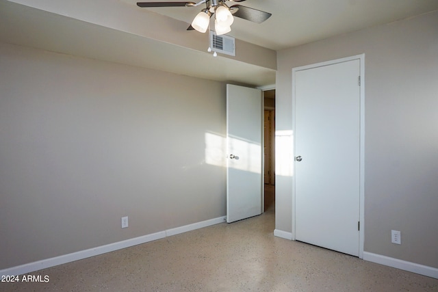 unfurnished bedroom featuring ceiling fan