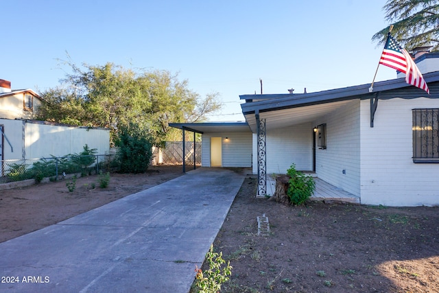 view of front of property with a carport