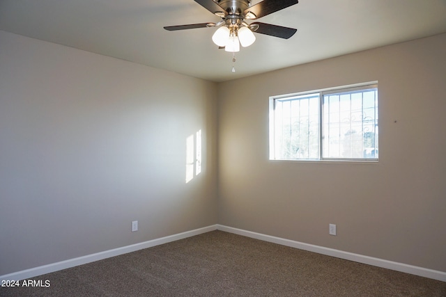 empty room with carpet flooring and ceiling fan