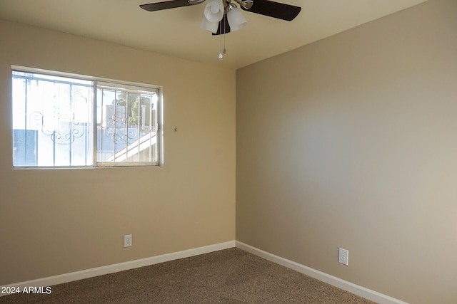 spare room featuring carpet flooring and ceiling fan