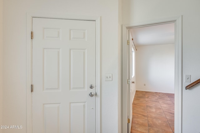 entryway with light tile patterned floors