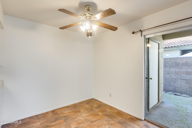 spare room with ceiling fan