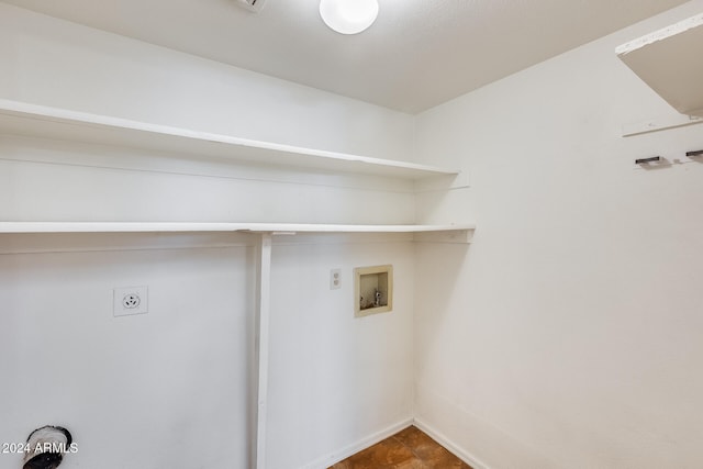 clothes washing area featuring hookup for an electric dryer and hookup for a washing machine