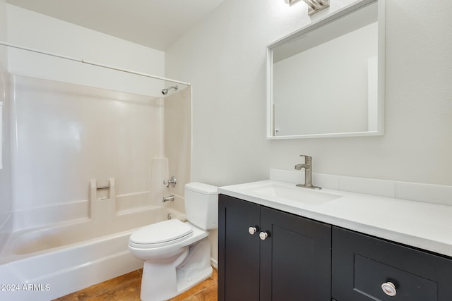 full bathroom featuring vanity,  shower combination, and toilet