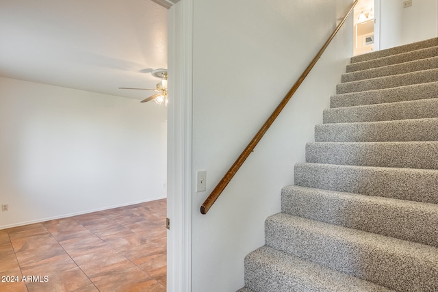 staircase with ceiling fan