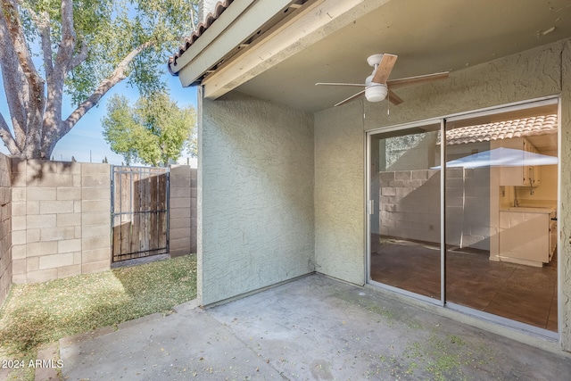 view of patio / terrace featuring ceiling fan