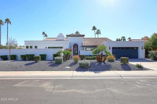 mediterranean / spanish-style house featuring a garage