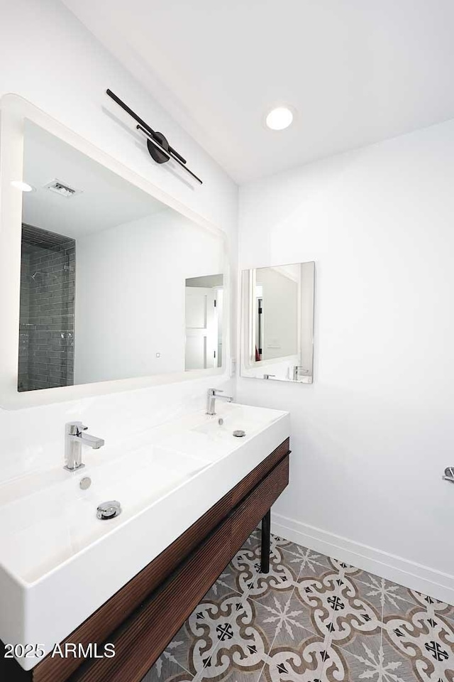 bathroom with vanity and tile patterned flooring