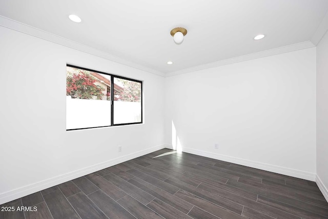 unfurnished room with crown molding