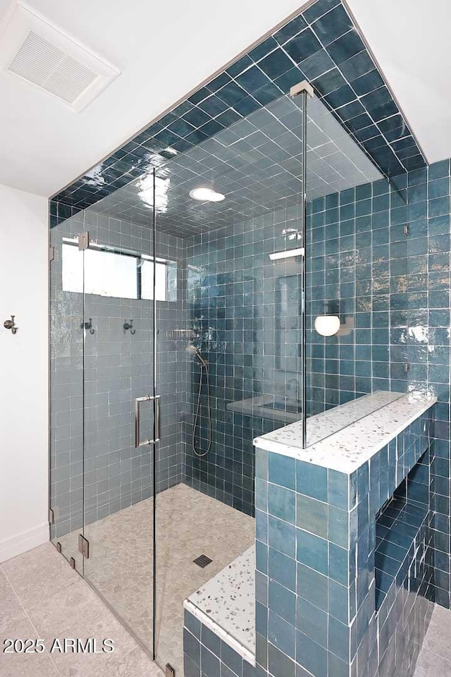 bathroom featuring tile patterned floors and walk in shower