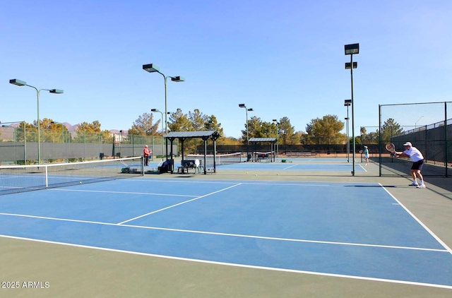 view of tennis court with basketball court