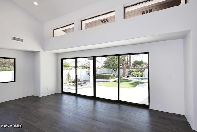 empty room featuring a high ceiling