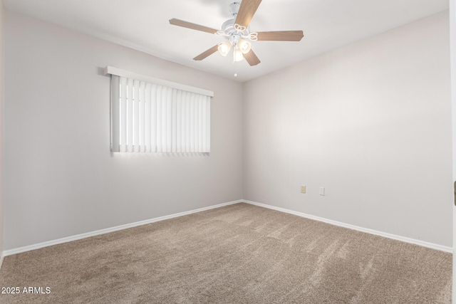 empty room featuring carpet flooring and ceiling fan