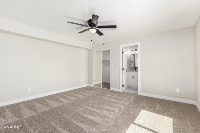 3249 E Nisbet Rd, Phoenix, AZ 85032 - unfurnished bedroom featuring visible vents, ensuite bathroom, a ceiling fan, baseboards, and light colored carpet