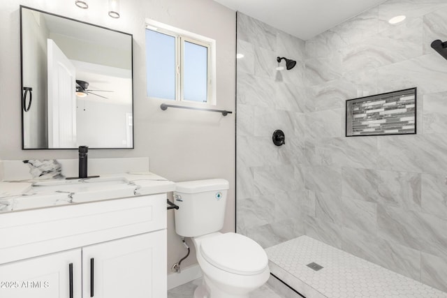 3249 E Nisbet Rd, Phoenix, AZ 85032 - full bathroom featuring ceiling fan, toilet, a tile shower, marble finish floor, and vanity