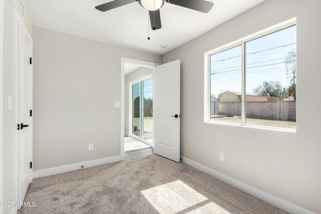 3249 E Nisbet Rd, Phoenix, AZ 85032 - unfurnished bedroom with baseboards, multiple windows, and carpet