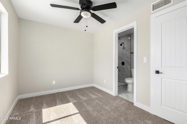 3249 E Nisbet Rd, Phoenix, AZ 85032 - unfurnished bedroom with visible vents, connected bathroom, baseboards, carpet, and a ceiling fan