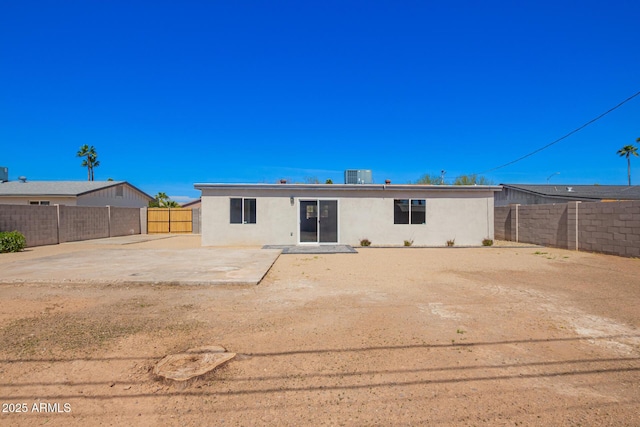 3249 E Nisbet Rd, Phoenix, AZ 85032 - back of property with a patio, central air condition unit, a fenced backyard, and stucco siding