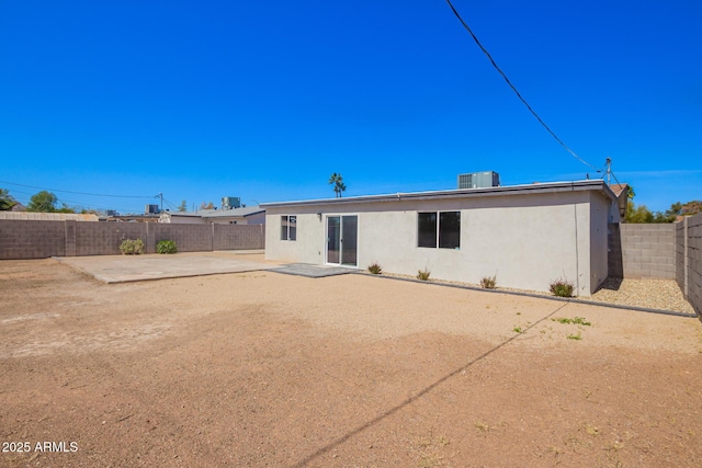 3249 E Nisbet Rd, Phoenix, AZ 85032 - back of property featuring stucco siding, central AC unit, a fenced backyard, and a patio area