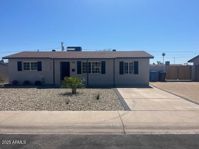 3249 E Nisbet Rd, Phoenix, AZ 85032 - single story home with stucco siding, driveway, roof with shingles, and fence