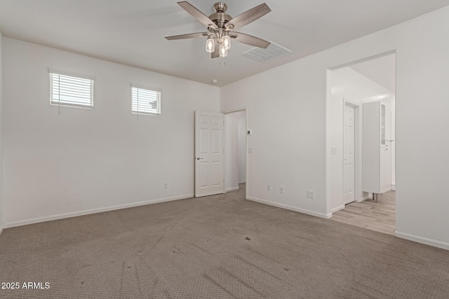 1857 W 22nd Ave, Apache Junction, AZ 85120 - carpeted spare room featuring a ceiling fan and baseboards