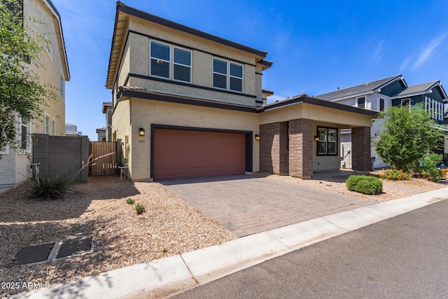 1857 W 22nd Ave, Apache Junction, AZ 85120 - view of front of house featuring a garage, stucco siding, decorative driveway, and a gate