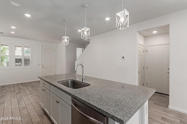 1857 W 22nd Ave, Apache Junction, AZ 85120 - kitchen with a sink, stainless steel dishwasher, light wood-style flooring, baseboards, and recessed lighting