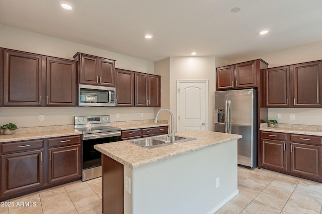 kitchen with recessed lighting, a sink, stainless steel appliances, light countertops, and dark brown cabinetry