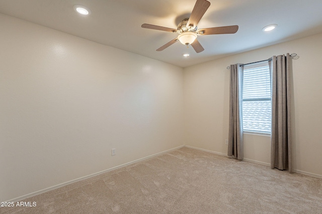 empty room featuring recessed lighting, baseboards, light carpet, and ceiling fan