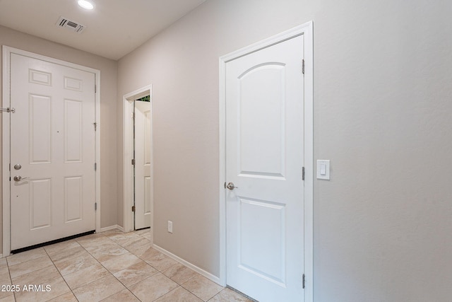 entryway with visible vents and baseboards