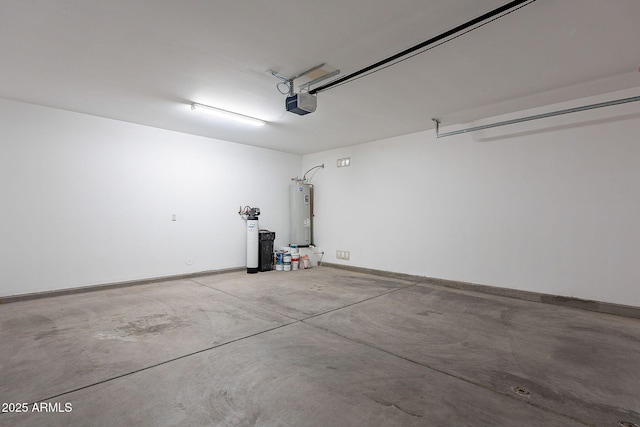 garage featuring water heater, a garage door opener, and baseboards