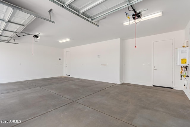 garage with water heater and a garage door opener