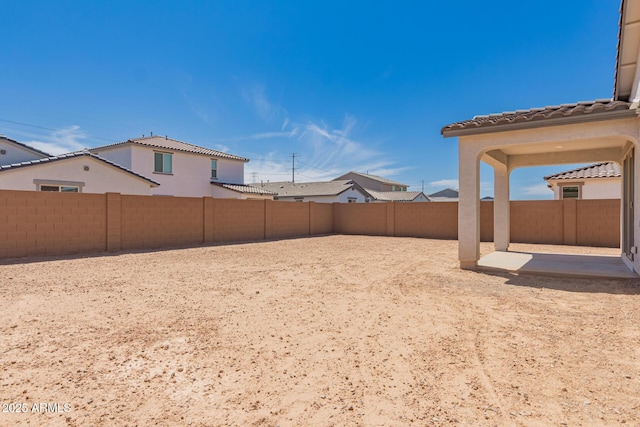 view of yard with a patio and a fenced backyard