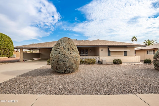 view of front of home with a carport